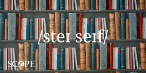 "Stay safe" written with the international phonetic alphabet, with bookshelves full of books in the background.